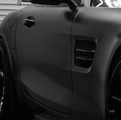 Black matte sports car side view.