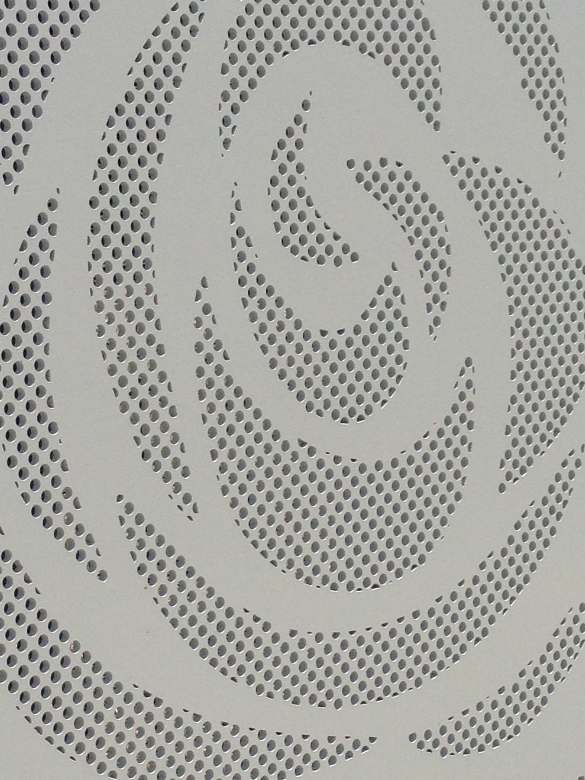 A close up of a spiral pattern on a white surface