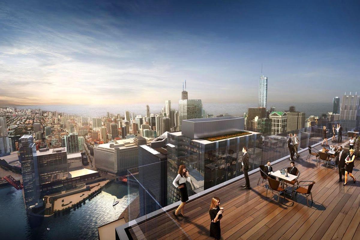 A group of people are standing on a rooftop deck overlooking a city.