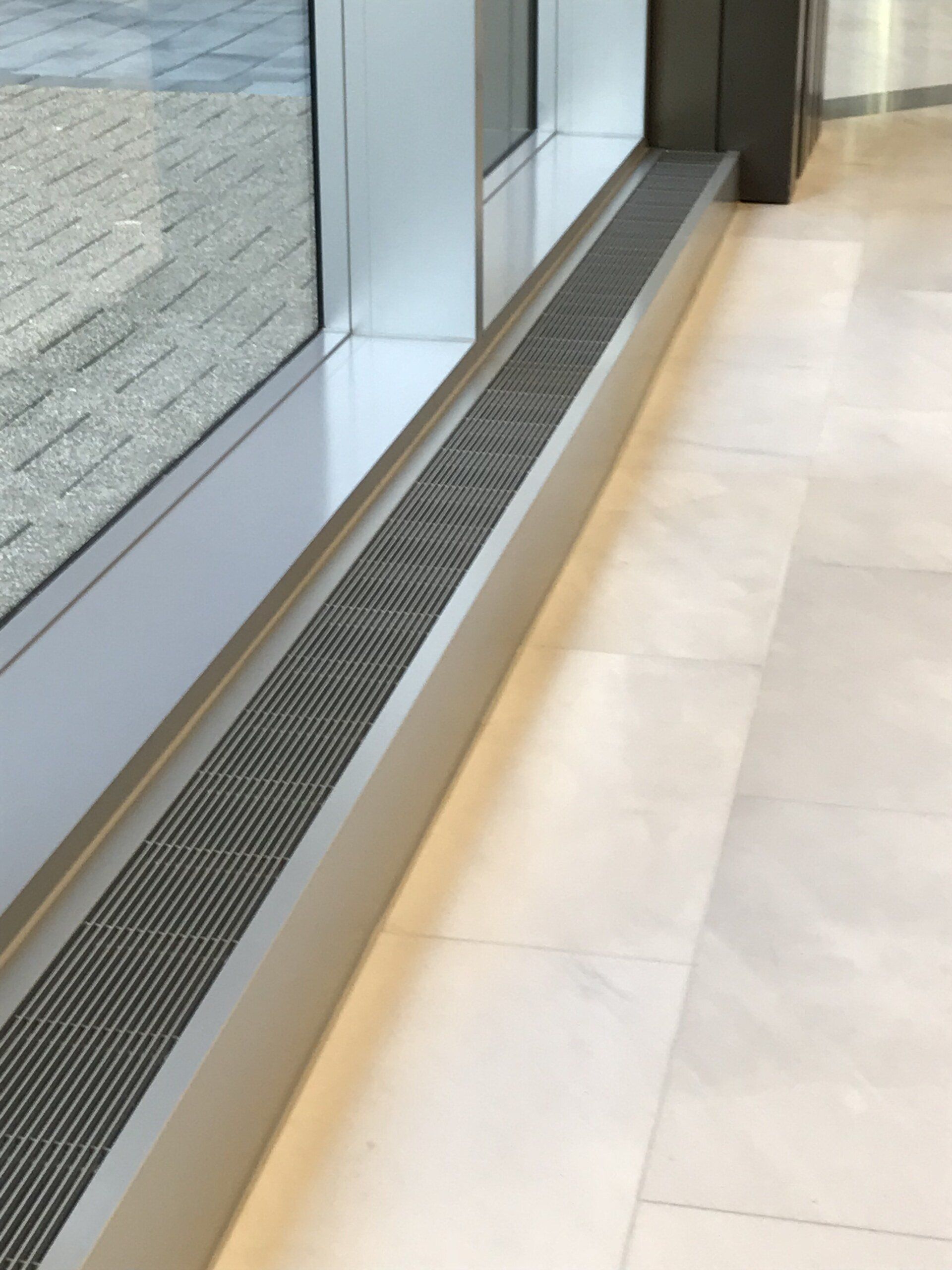 A window with a metal grate on the side of it