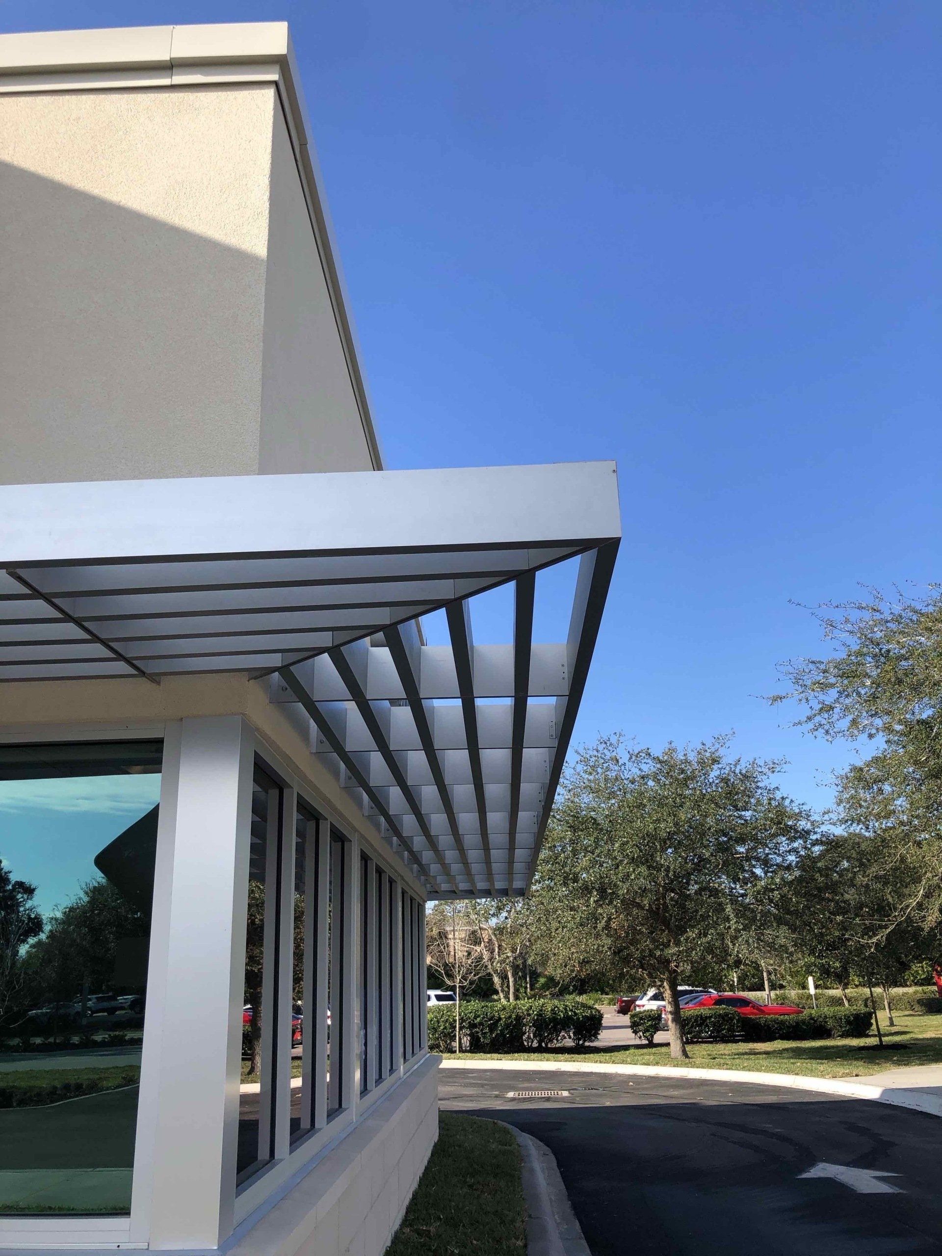 A building with a lot of windows and a canopy over it.