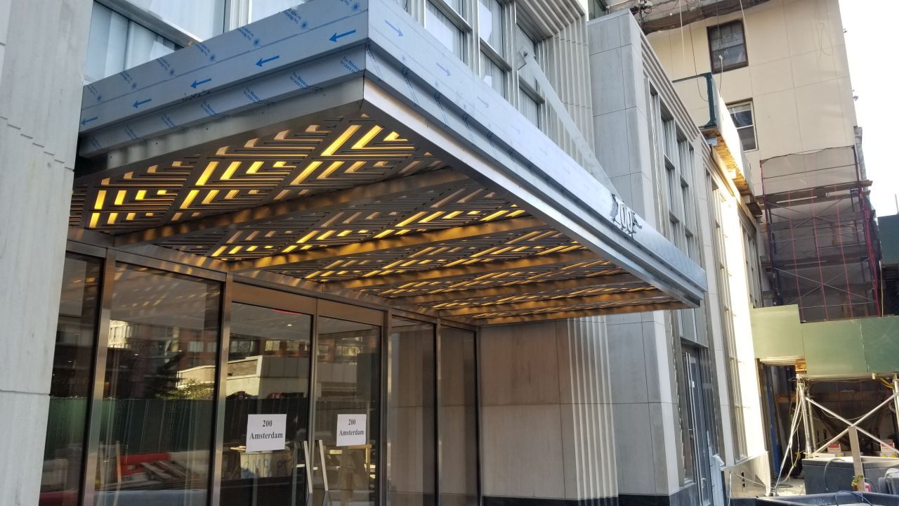 A large building with a canopy over the entrance