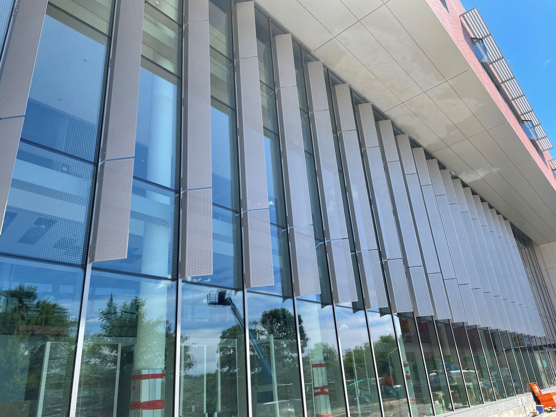 A building with a lot of windows and a red roof