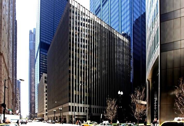 A city street with a lot of tall buildings