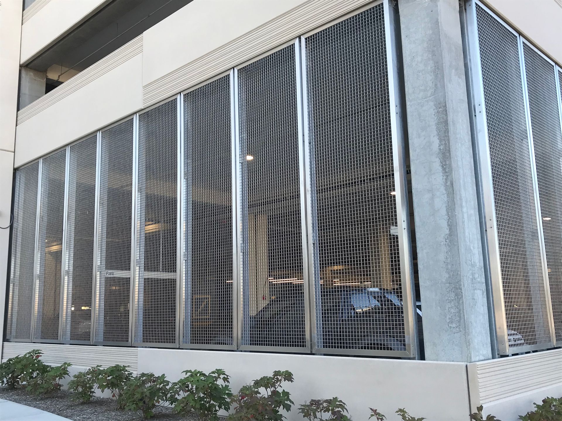 A building with a lot of windows and a fence around it