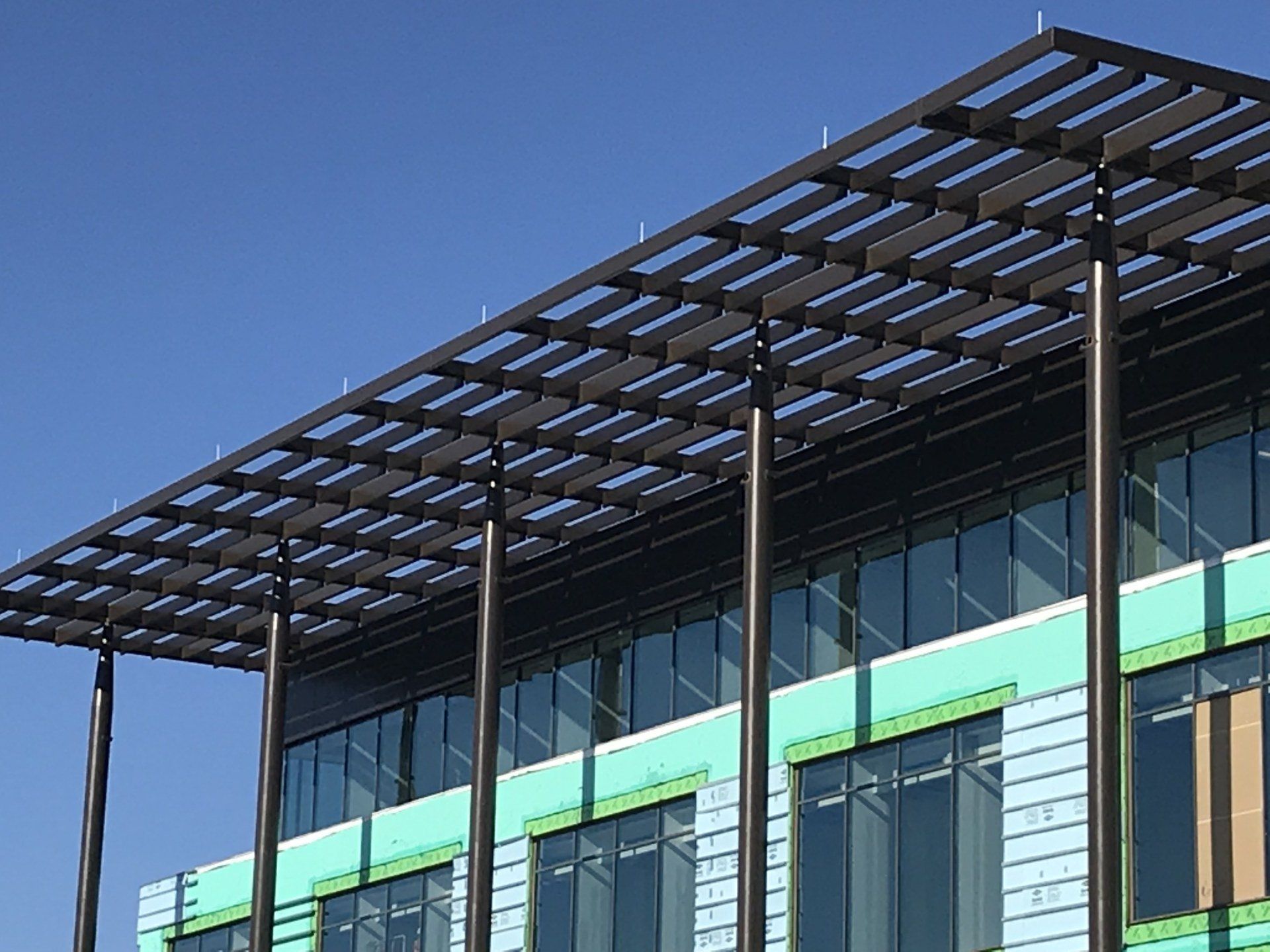 A large building with a pergola on top of it
