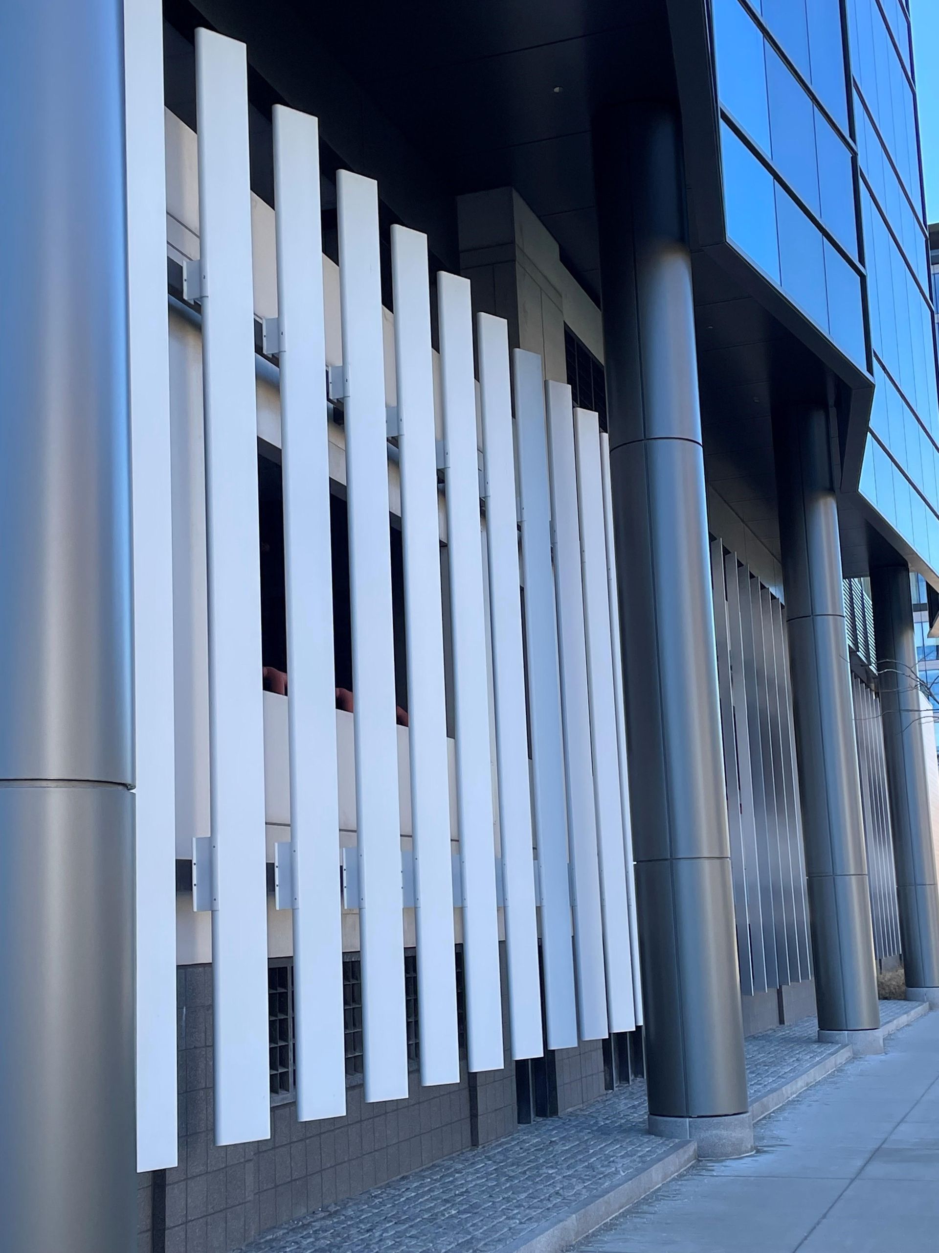 A building with a lot of windows and a white fence