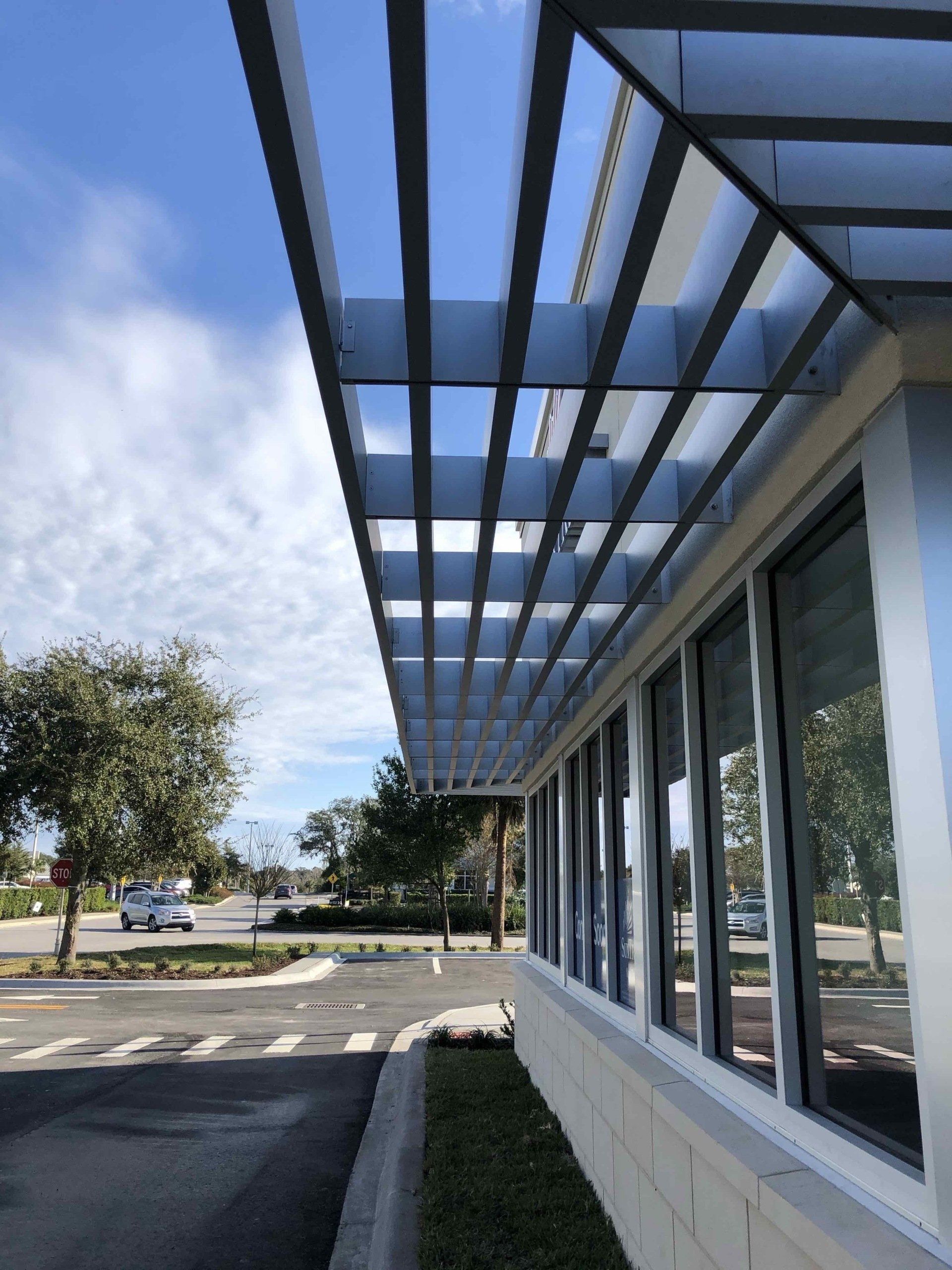 A building with a lot of windows and a canopy over it