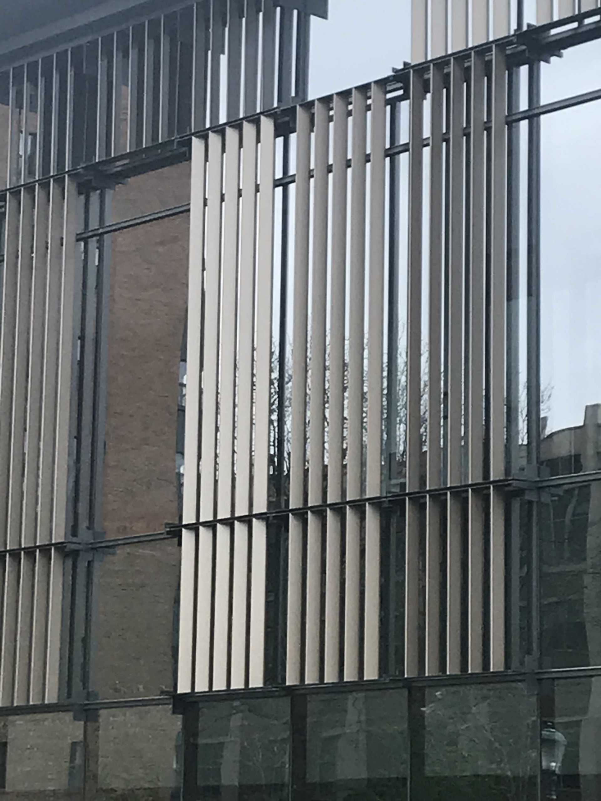 A building with a lot of windows and a fence