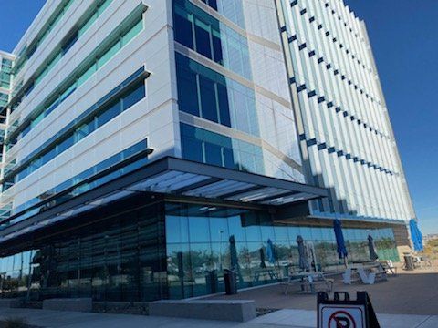 A large building with a no parking sign in front of it