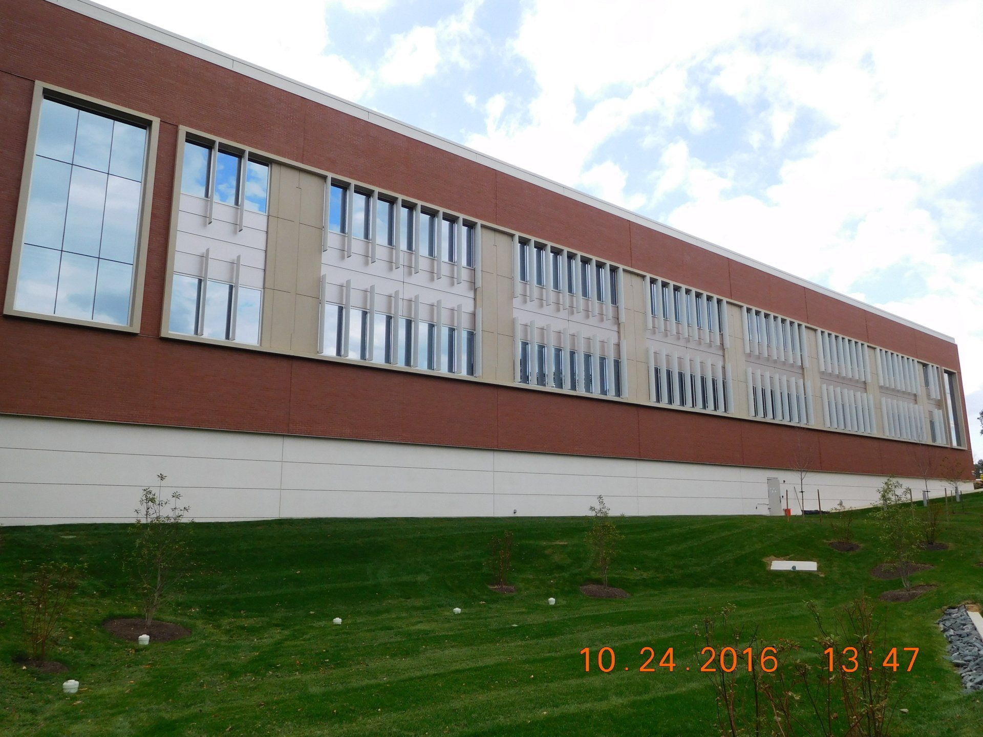 A large brick building with a lot of windows taken on october 24th 2018