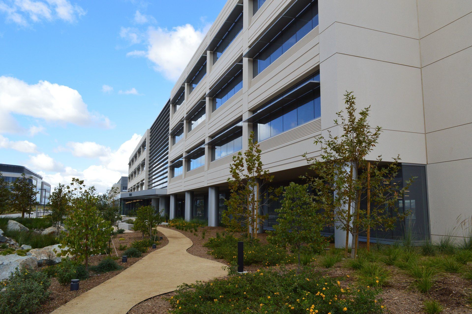 A large building with a walkway leading to it