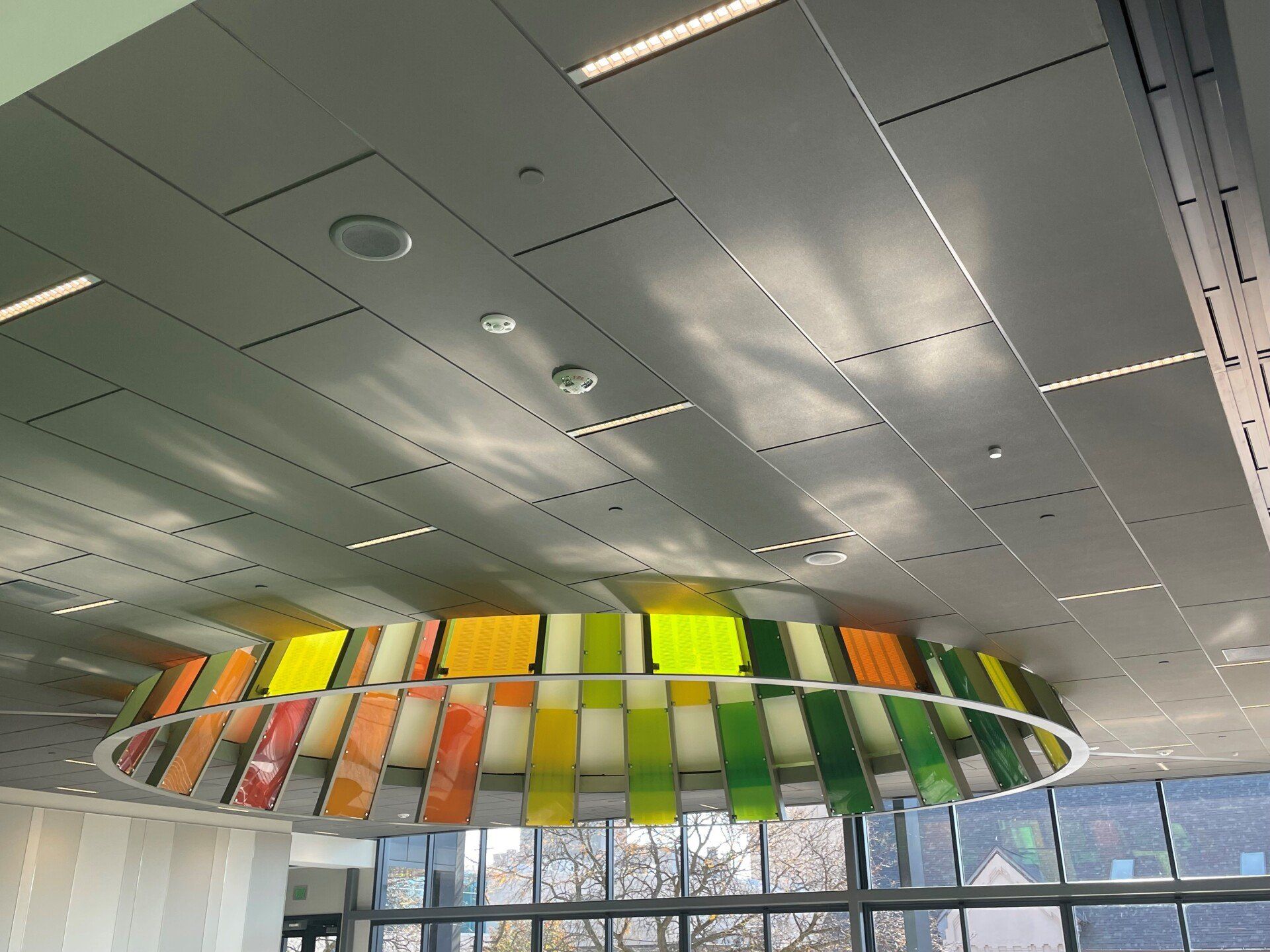 A ceiling with a colorful circle hanging from it