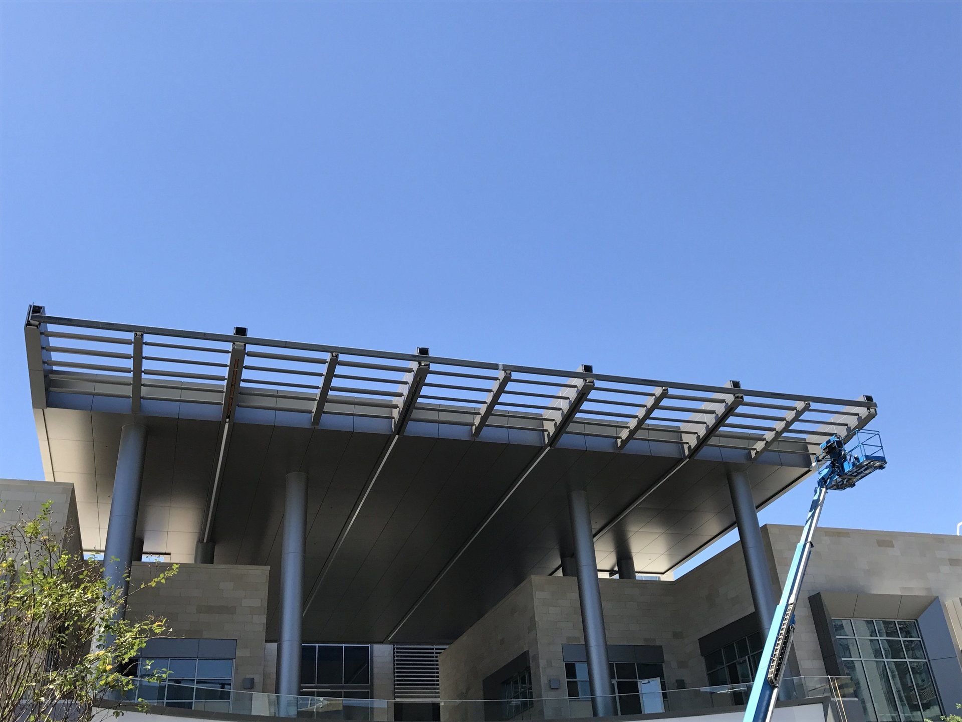 A large building with a blue sky in the background