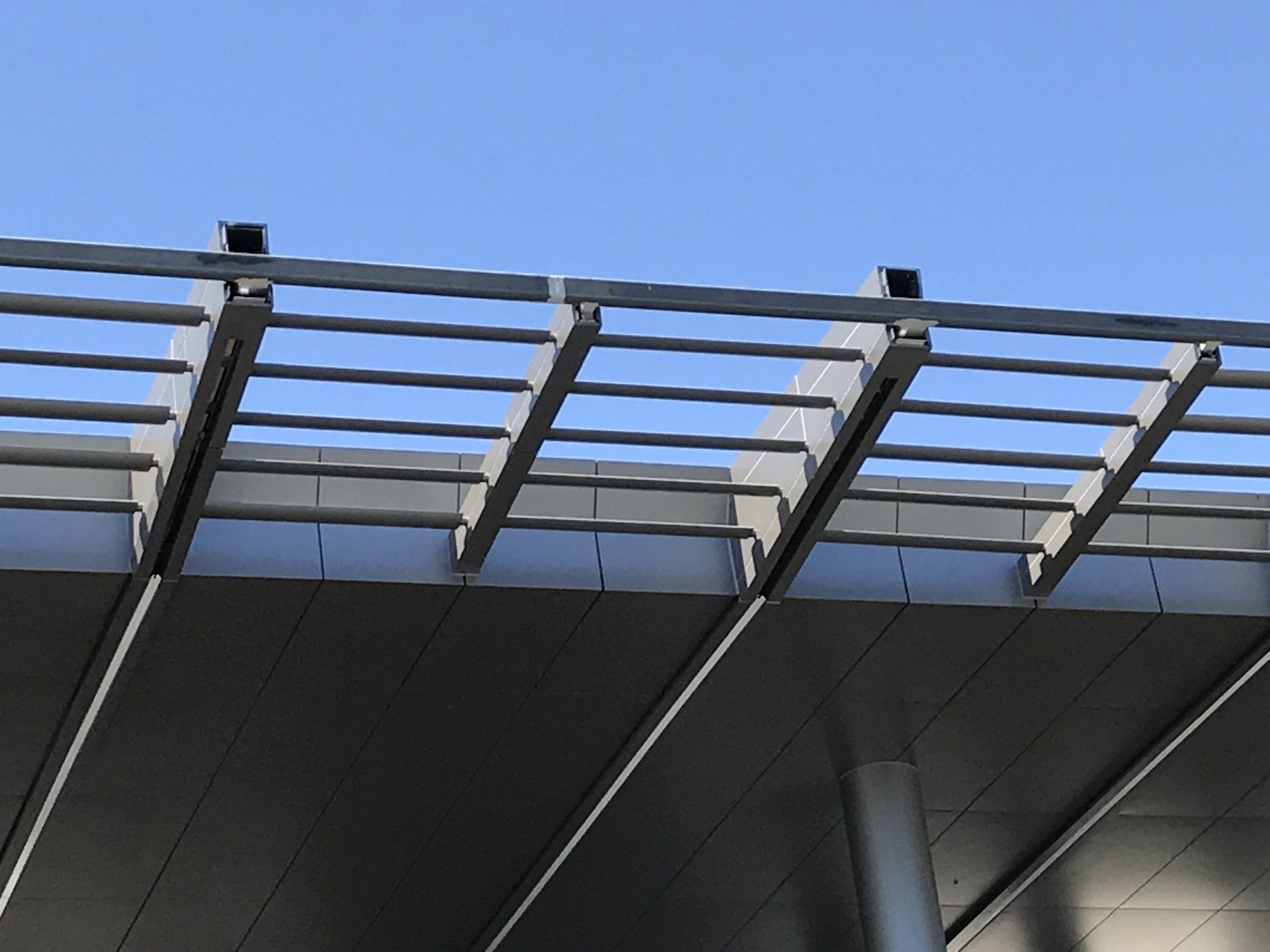 A bridge with a blue sky in the background