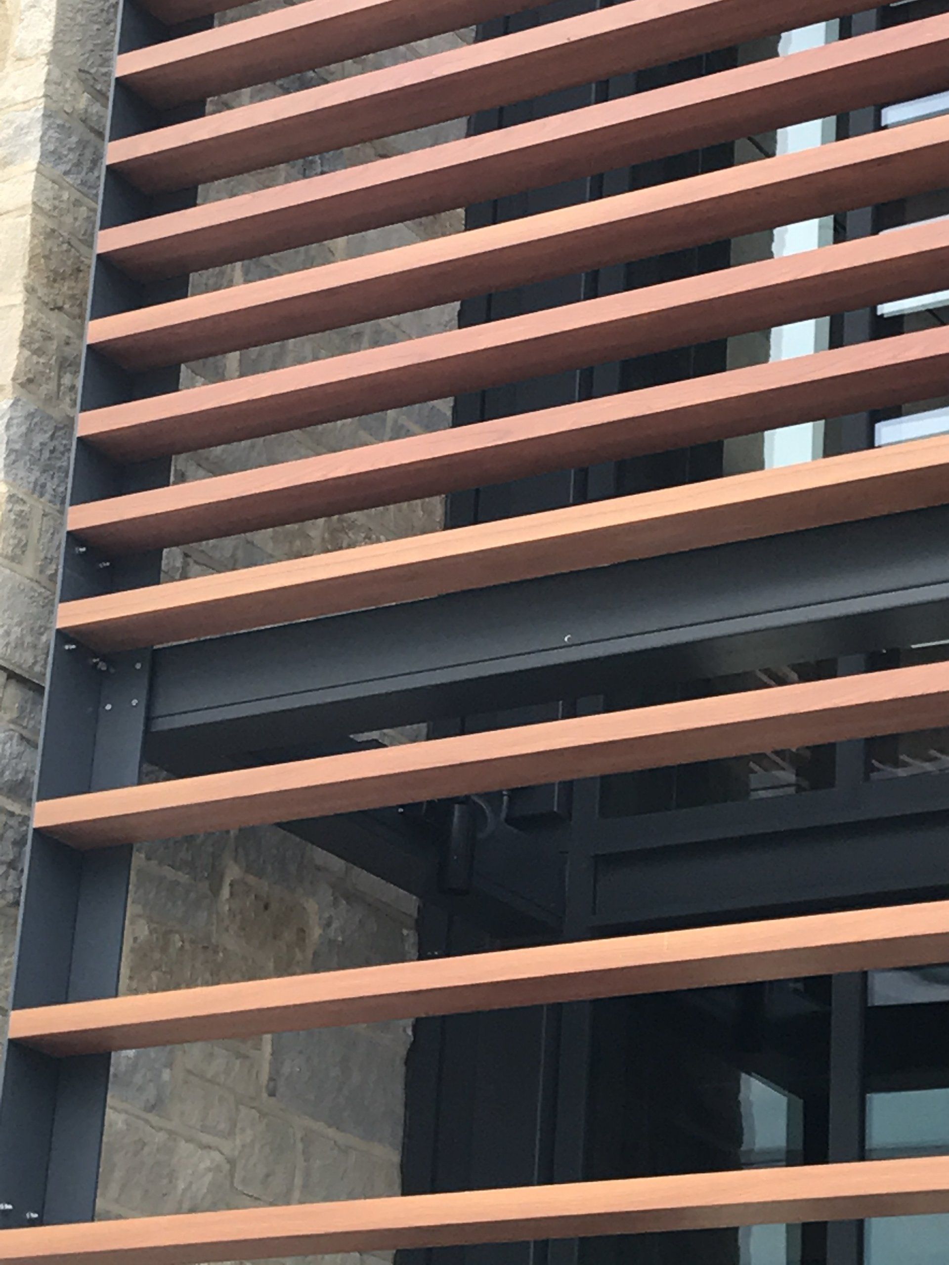 A building with wooden shutters on the side of it