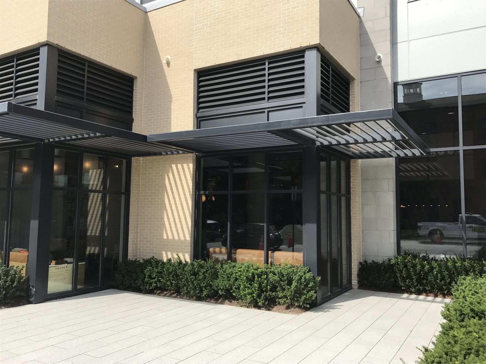 A building with a lot of windows and a canopy over it
