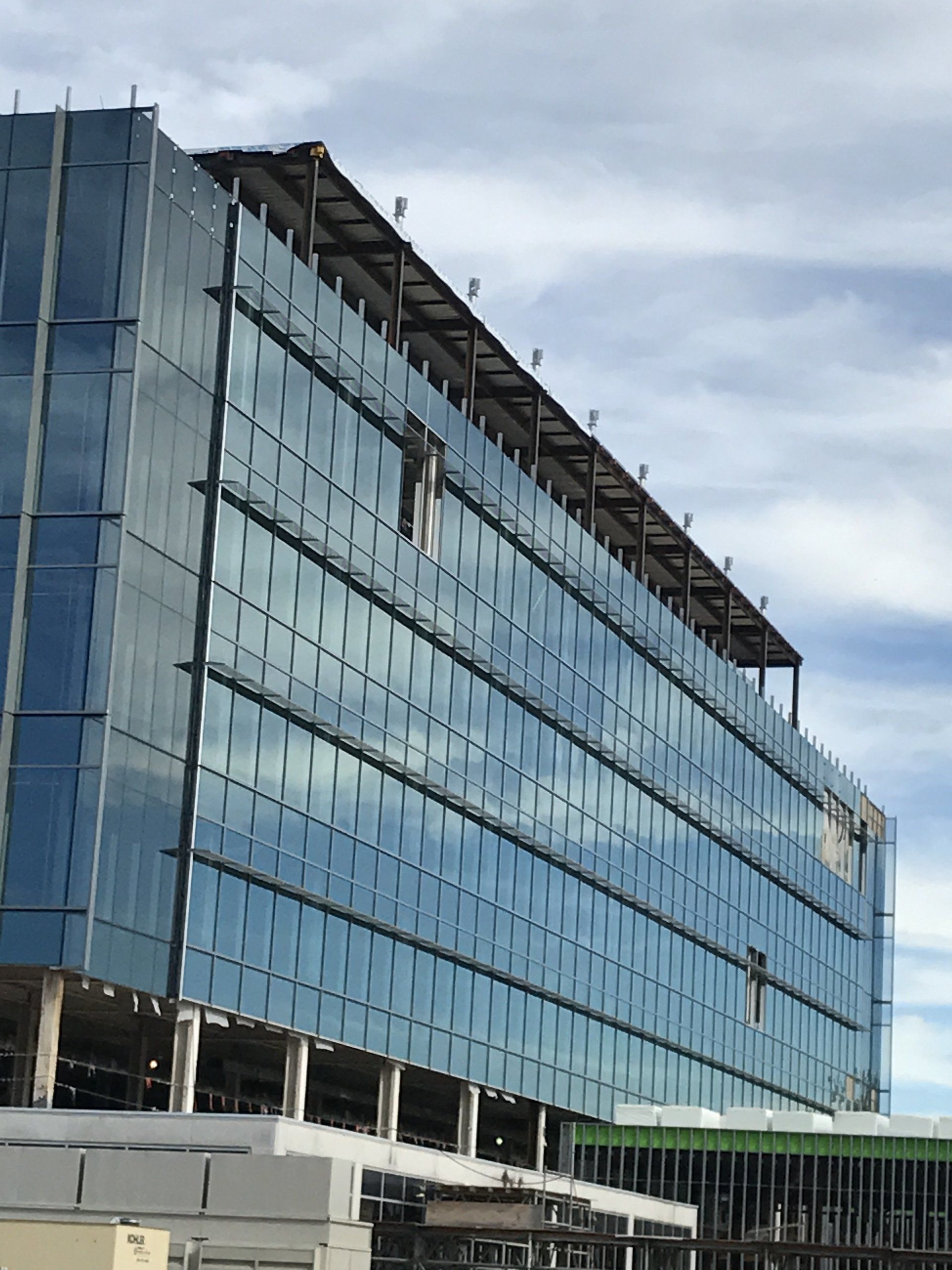 A large building with a lot of windows is under construction