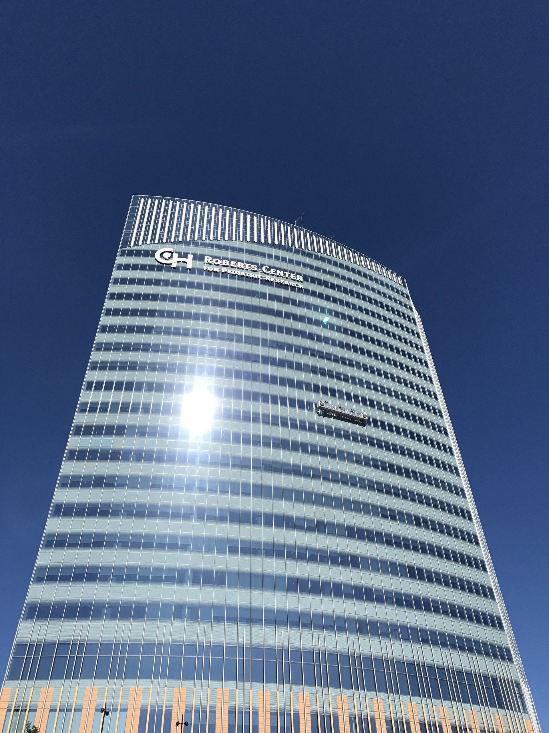 A tall building with a blue sky in the background