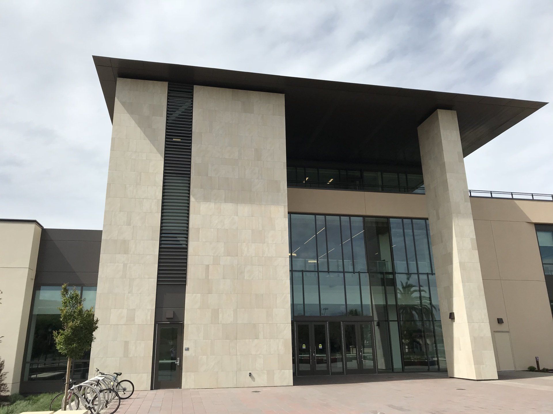 A large building with bikes parked in front of it