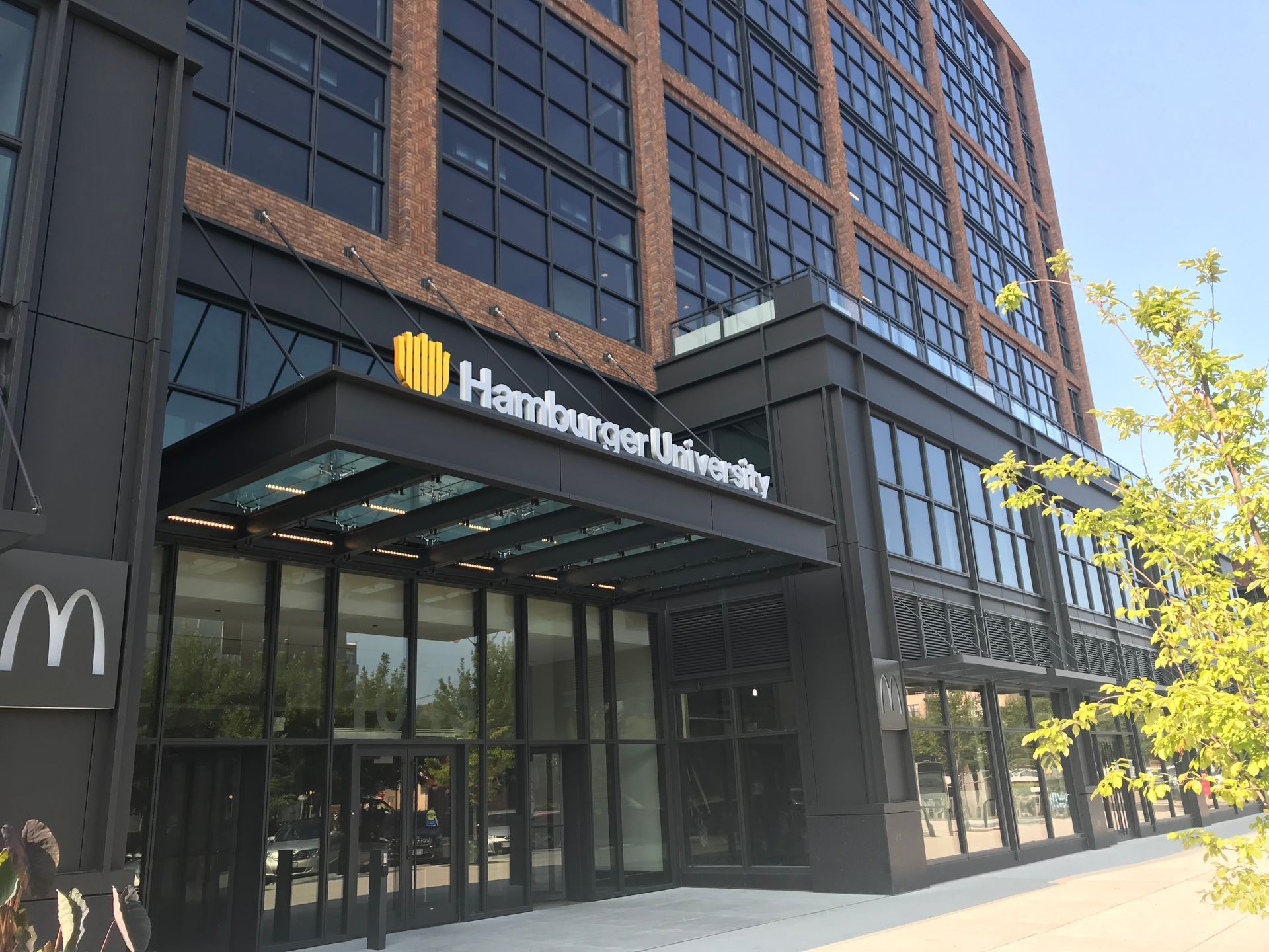 A large building with a mcdonald 's sign in front of it.
