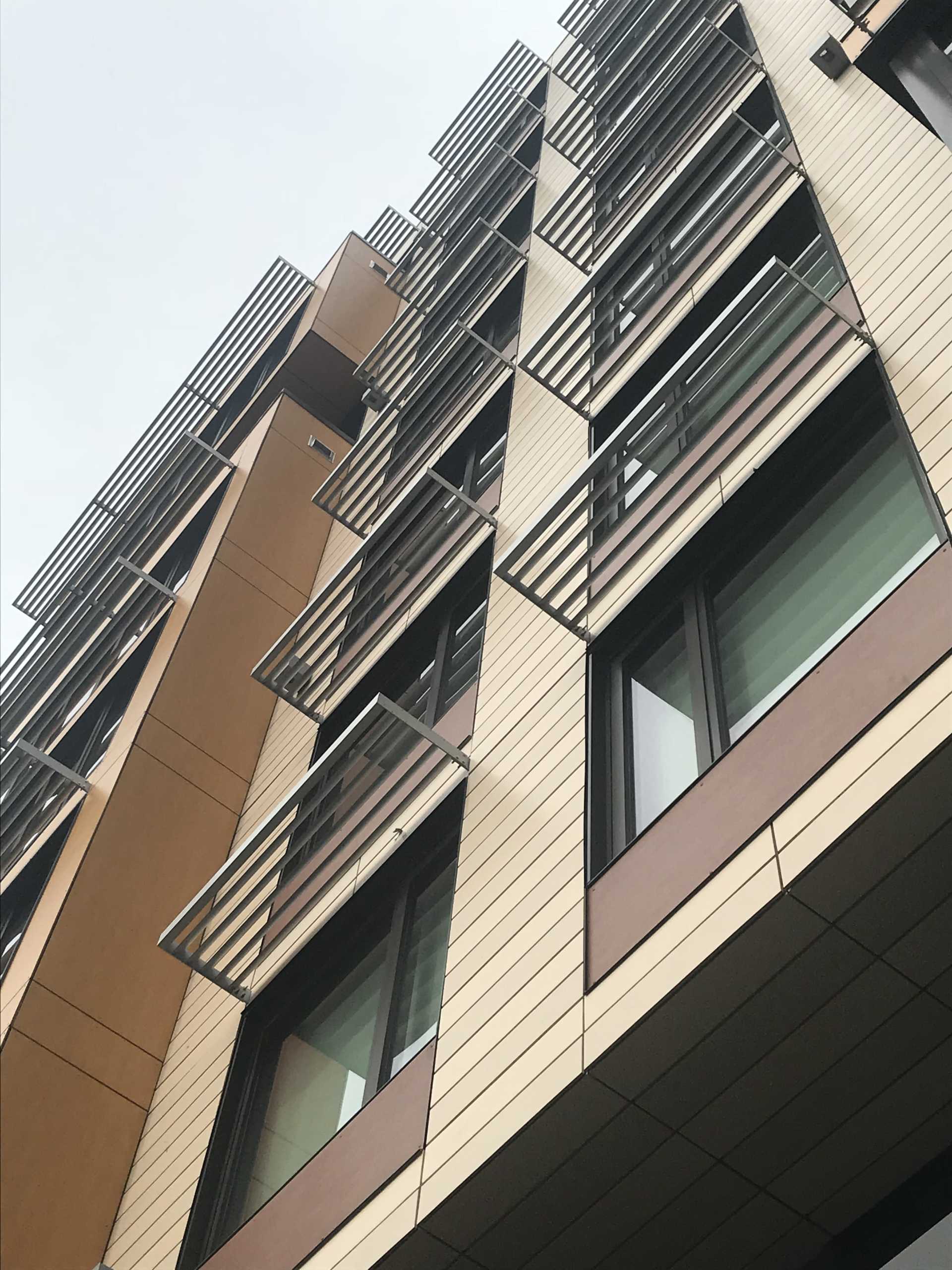 Looking up at a building with a lot of windows