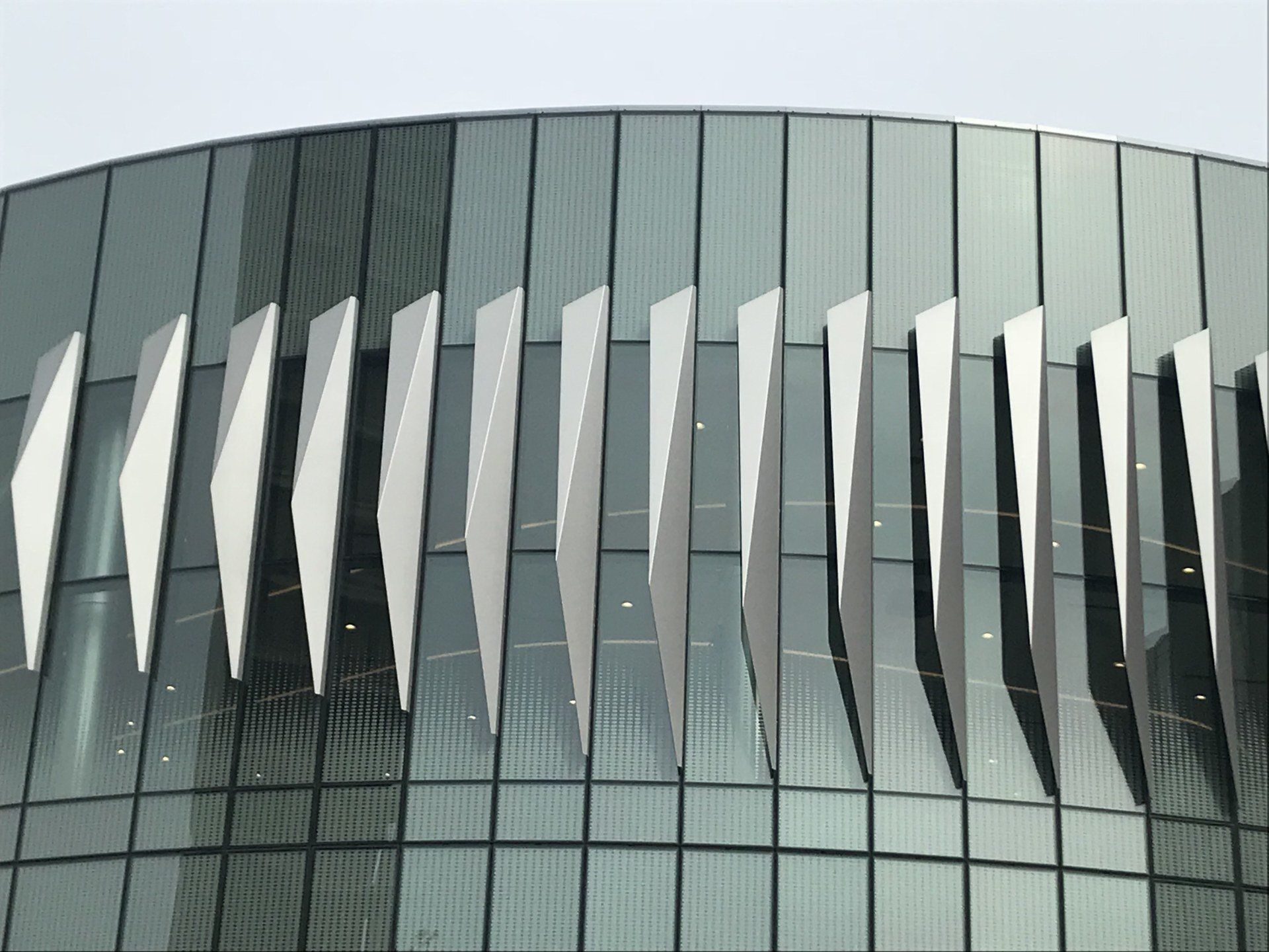 A building with a lot of windows and a row of white lines on it