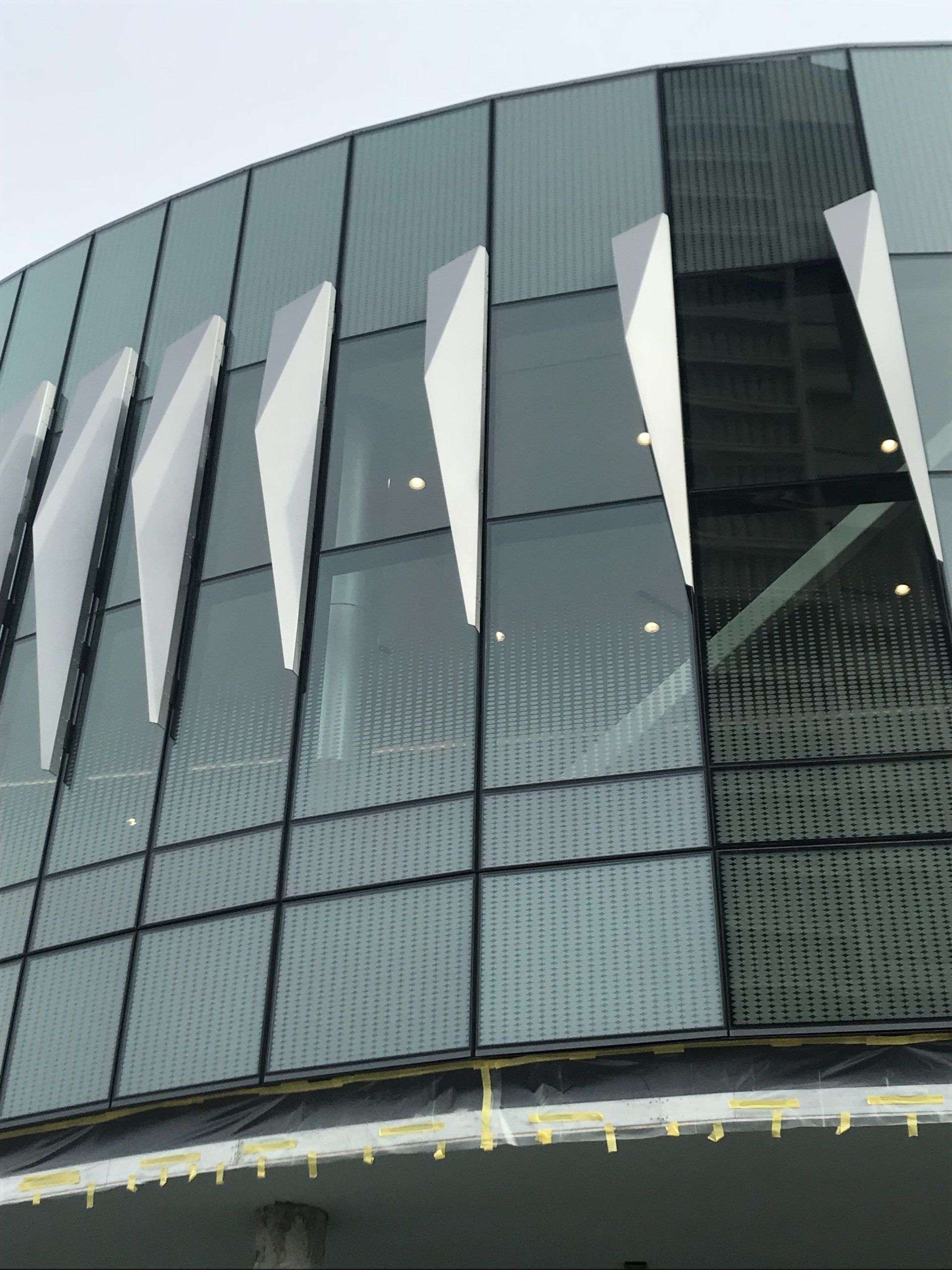 A building with a lot of windows and a sign that says ' theatre ' on it