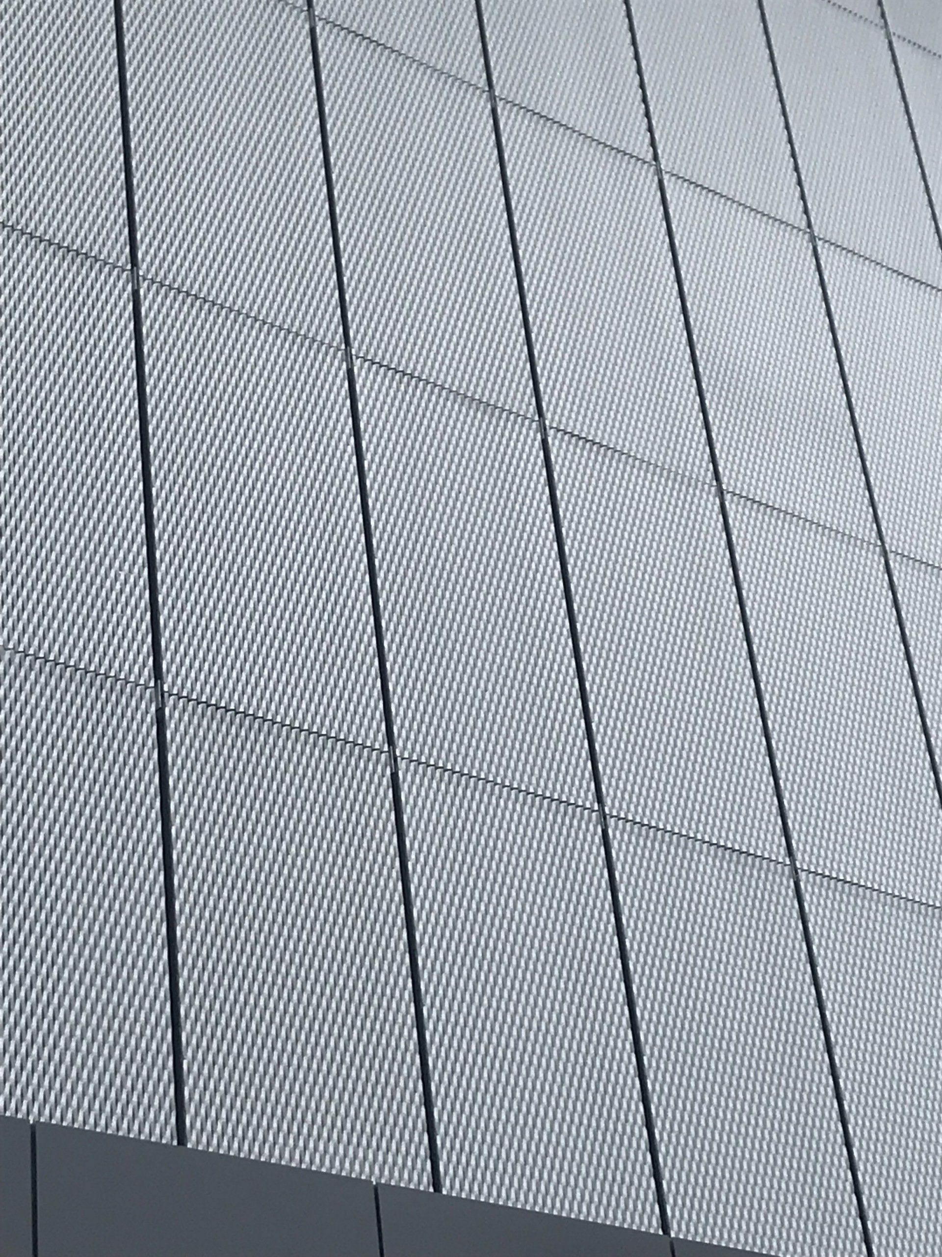 A close up of a building with a grid pattern