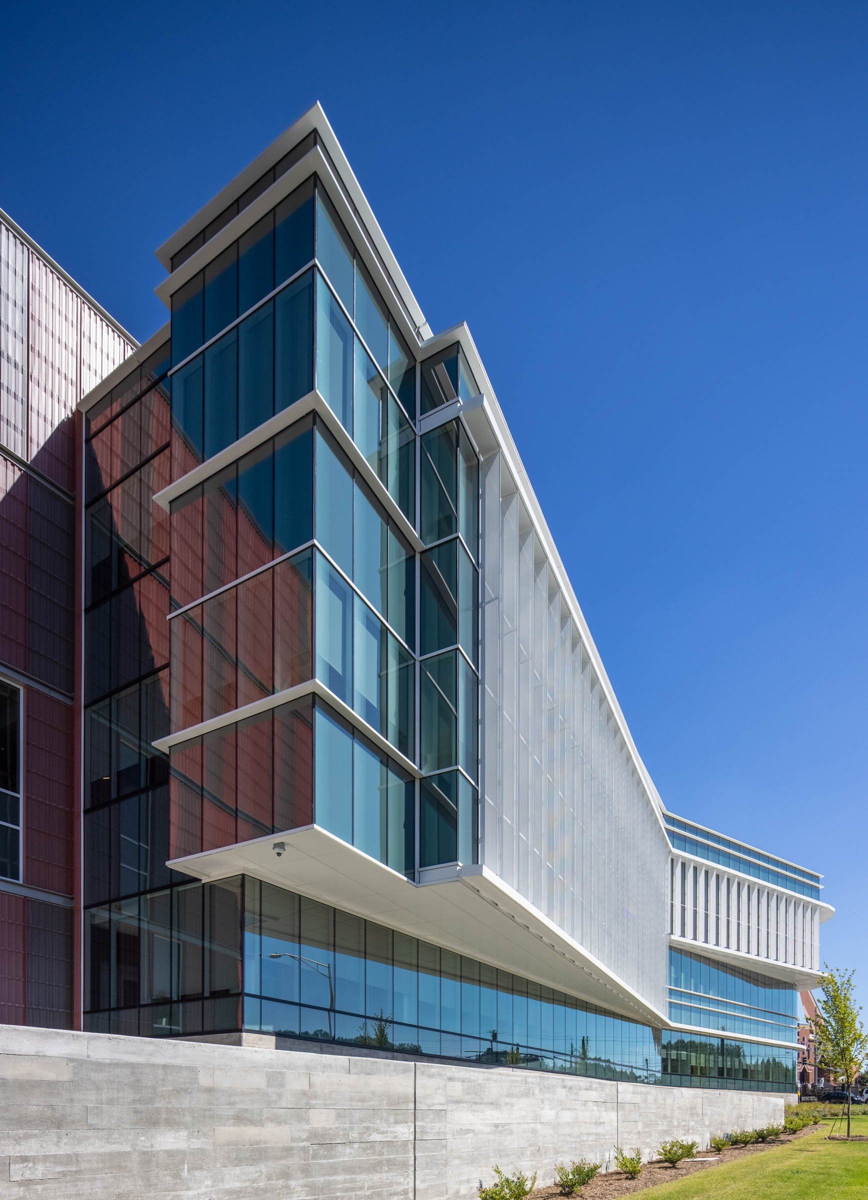 A large building with a lot of windows on a sunny day