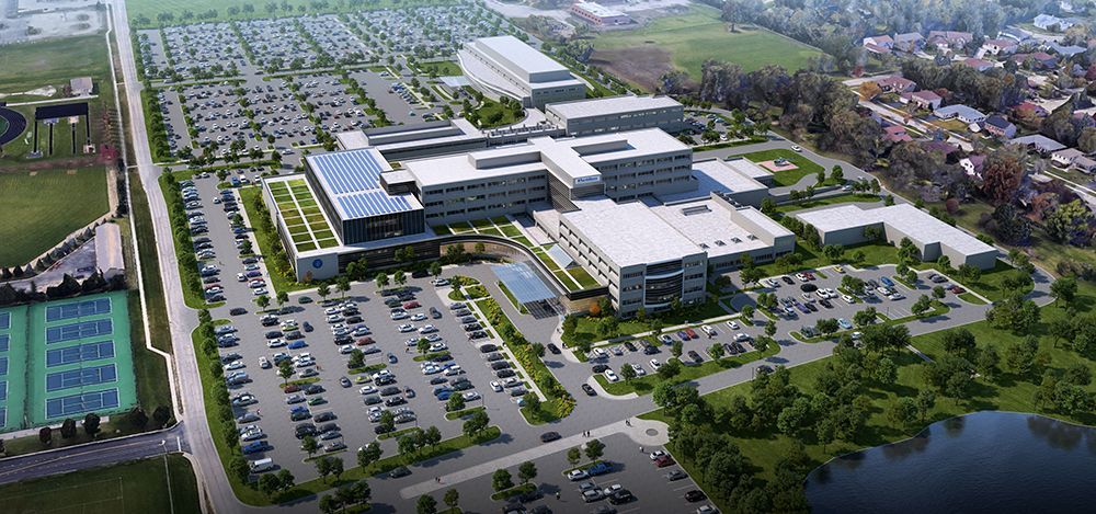 An aerial view of a large building with a lot of parking spaces