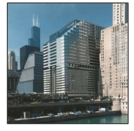 A picture of a city skyline with a river in the foreground