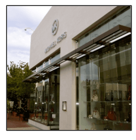 A michael kors store with lots of glass windows