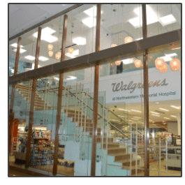 A walgreens store with stairs leading up to it