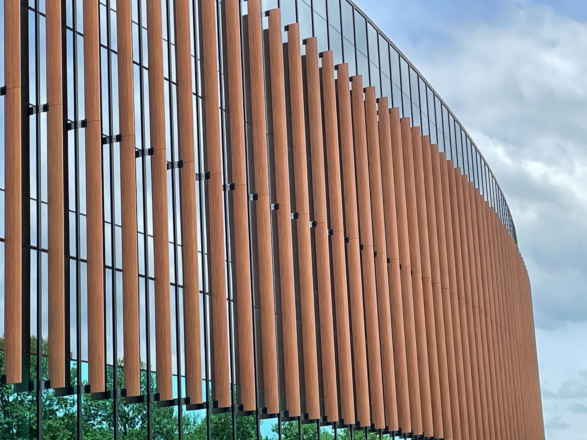 A building with a lot of windows and a fence
