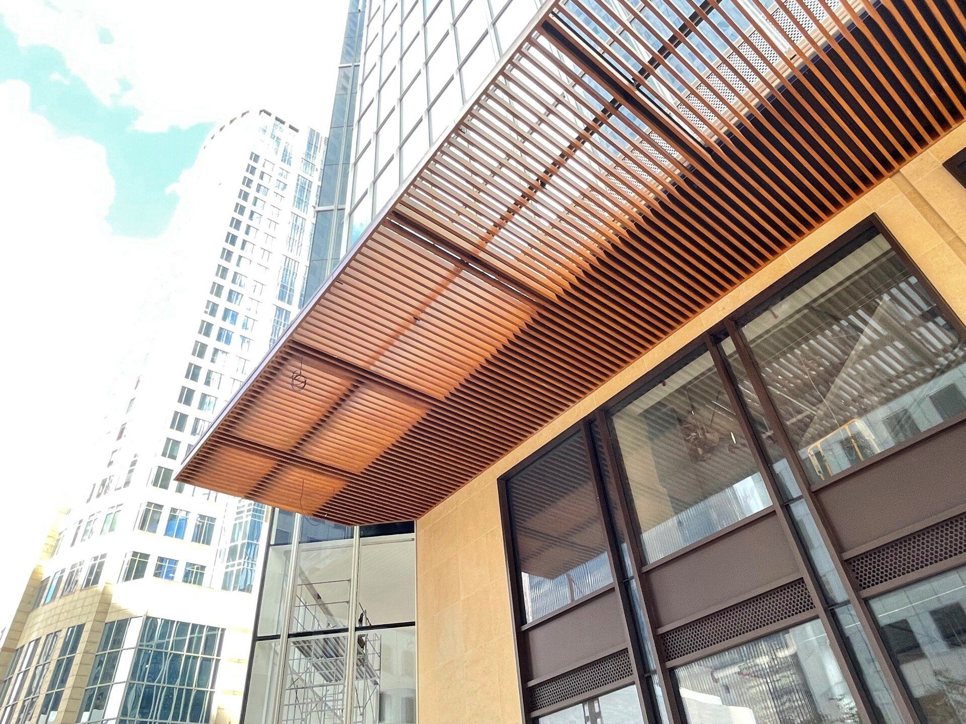A building with a wooden canopy on top of it