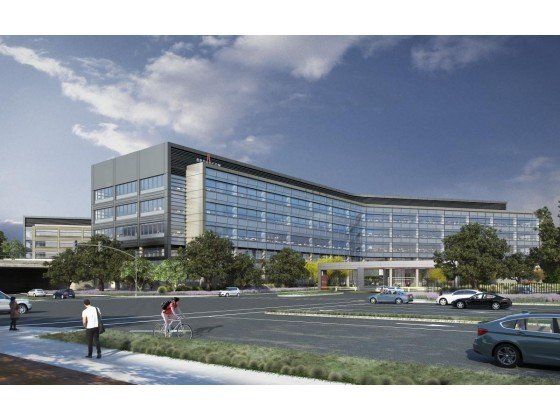 An artist 's impression of a large building with cars parked in front of it.