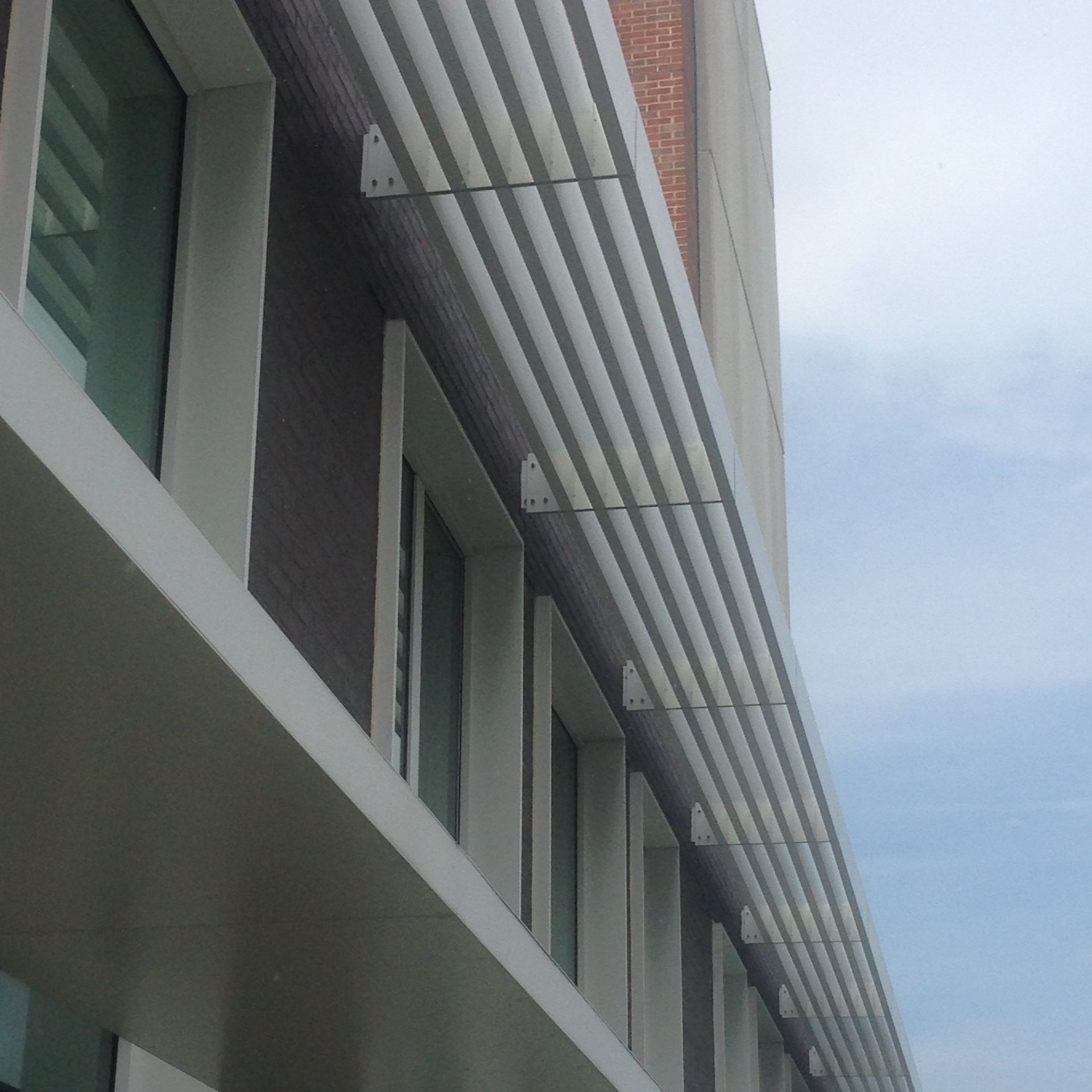 A building with a lot of windows and a canopy