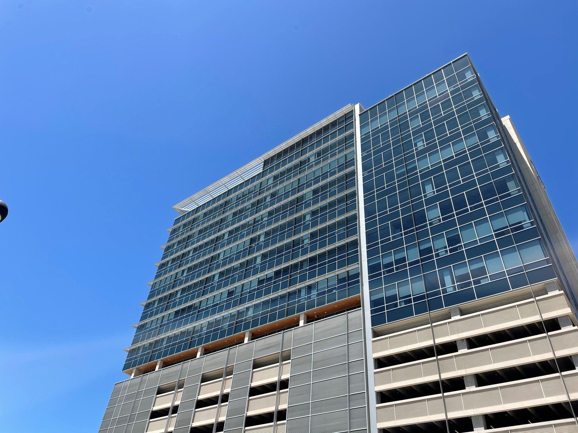 Looking up at a tall building with a blue sky in the background