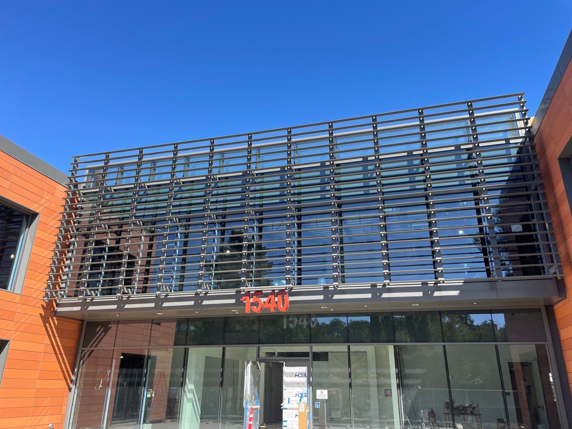 A large building with a lot of windows and a sign that says total