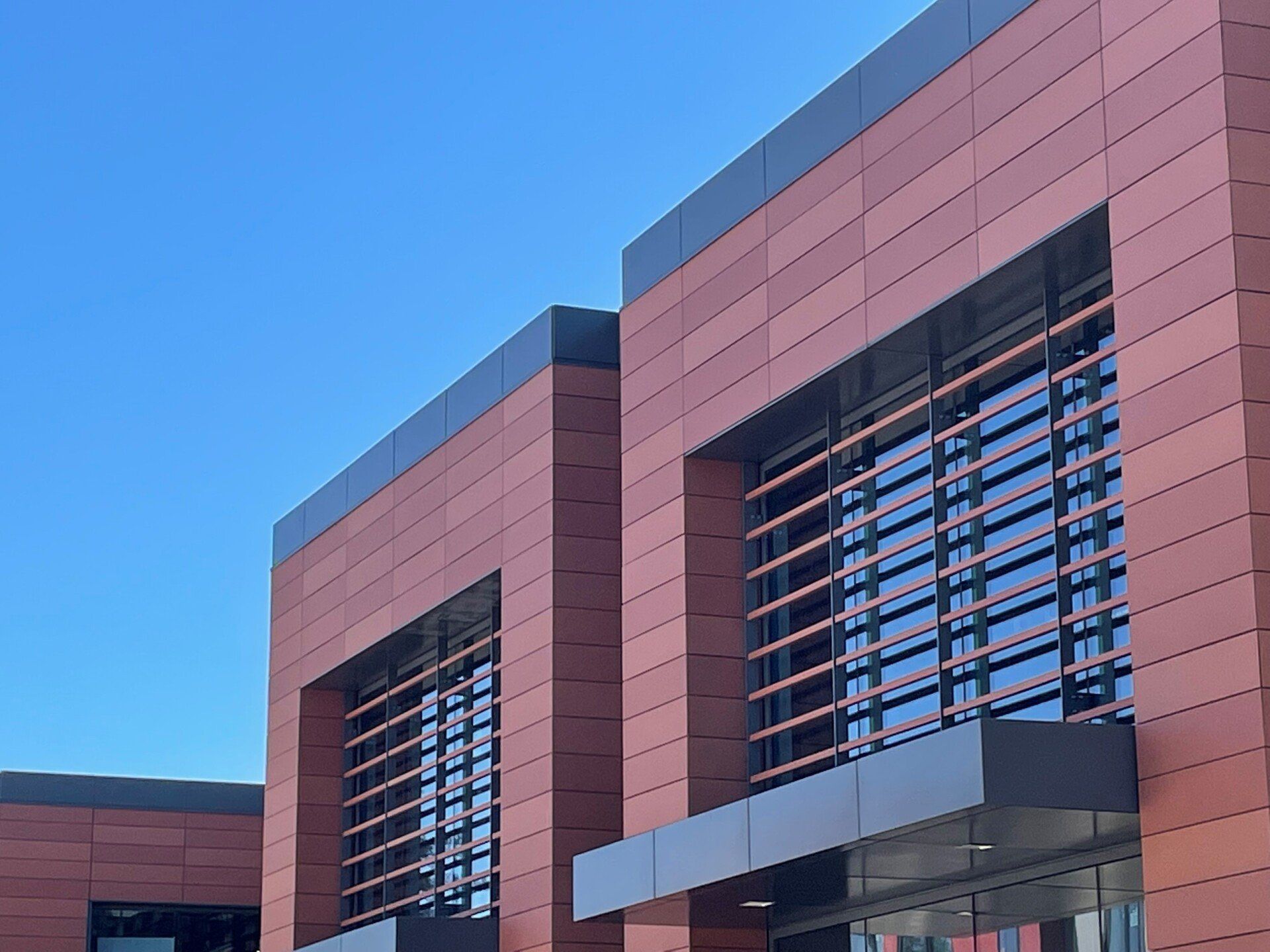 A brick building with a blue sky in the background