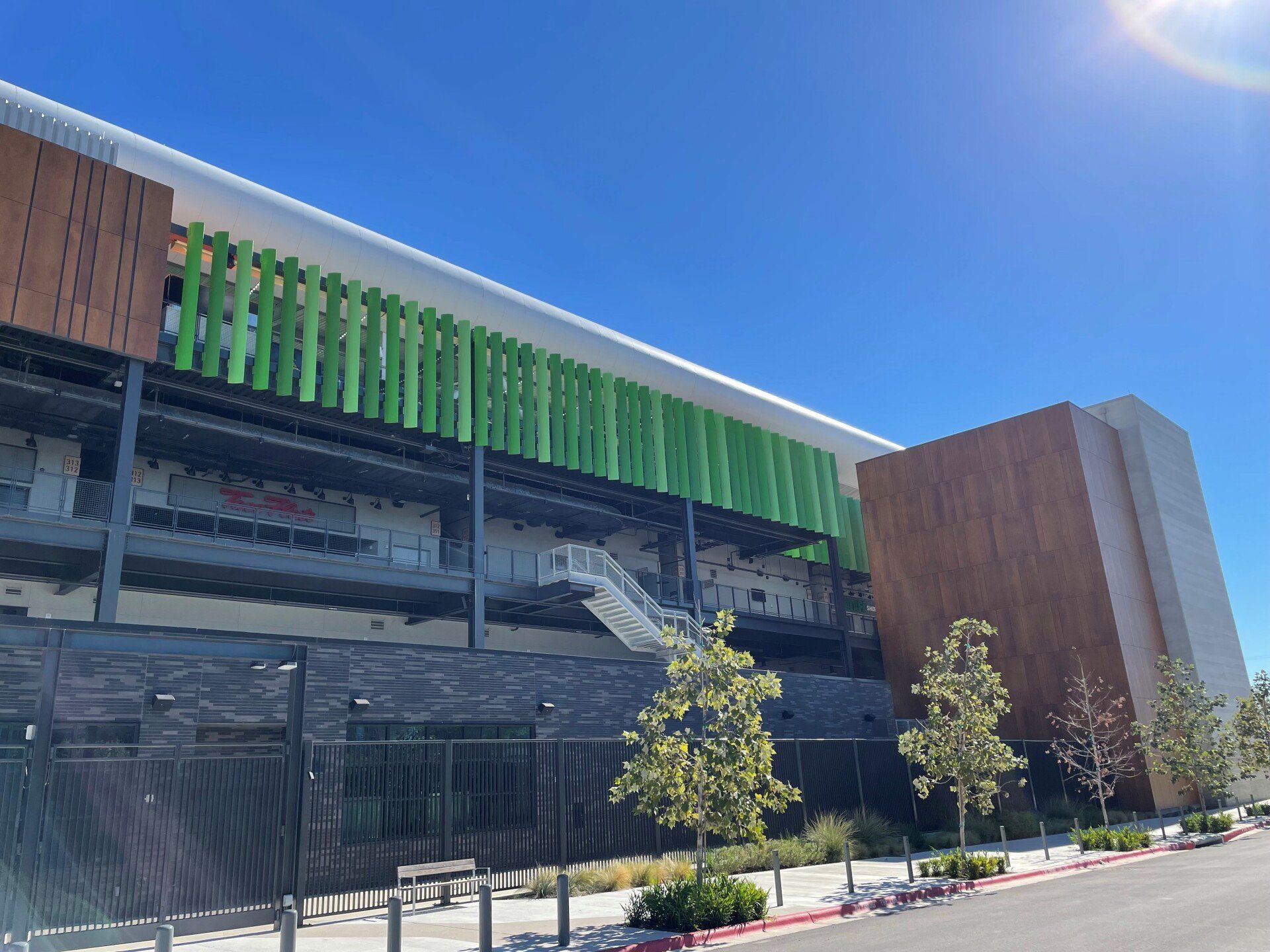 A large building with a green roof and stairs
