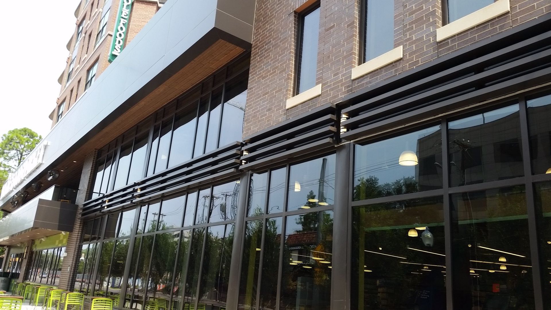 A large building with lots of windows and a sign that says starbucks