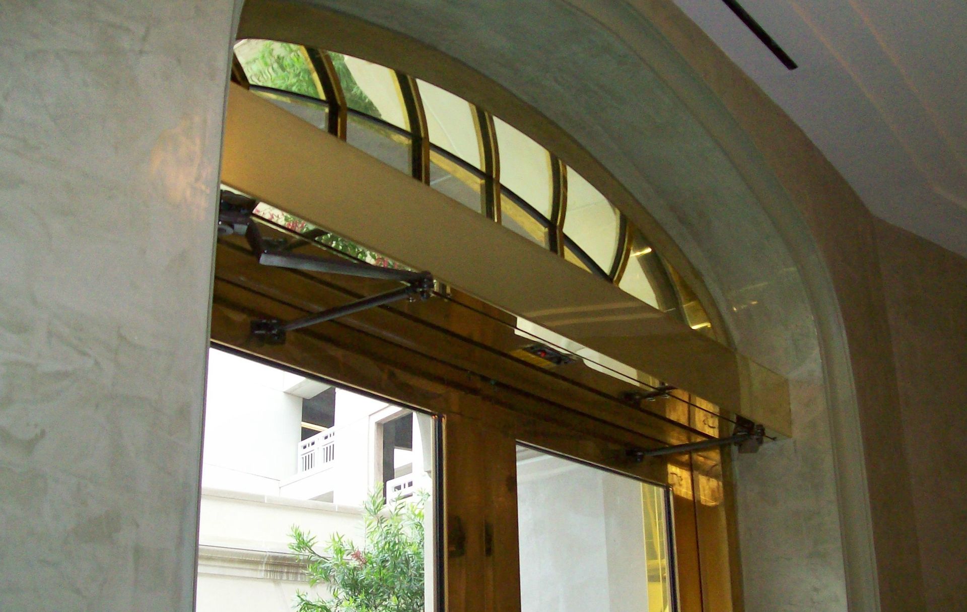 A window with a stained glass window and a sliding glass door