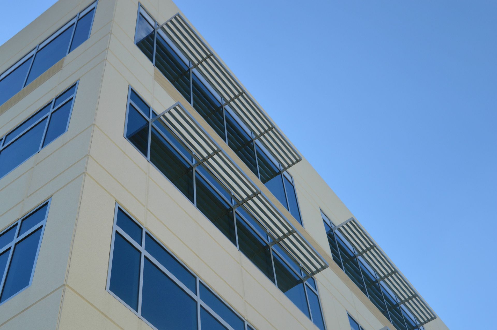 Looking up at a building with lots of windows