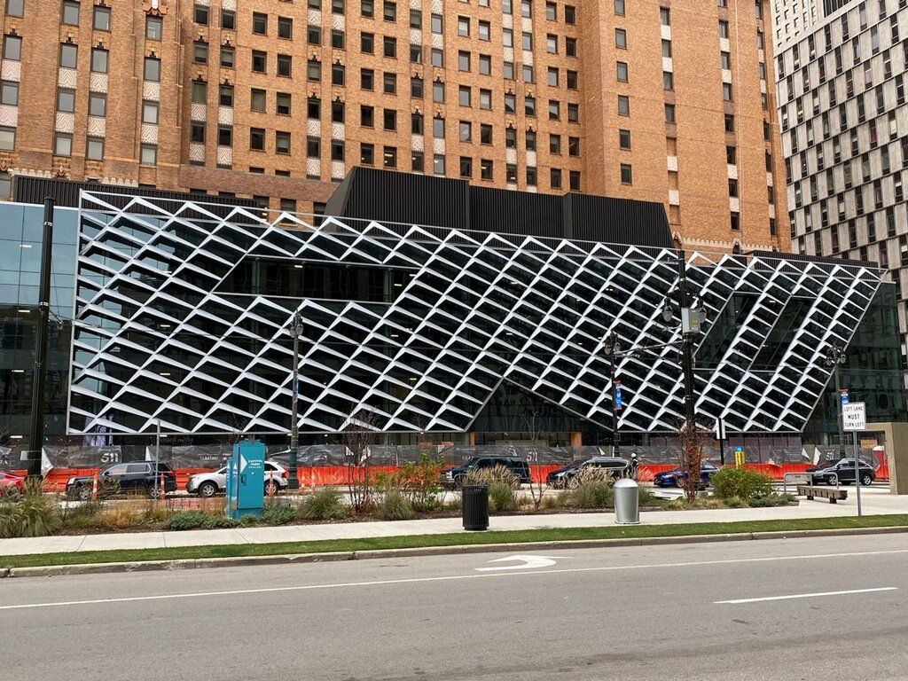 A large building with a black and white pattern on it