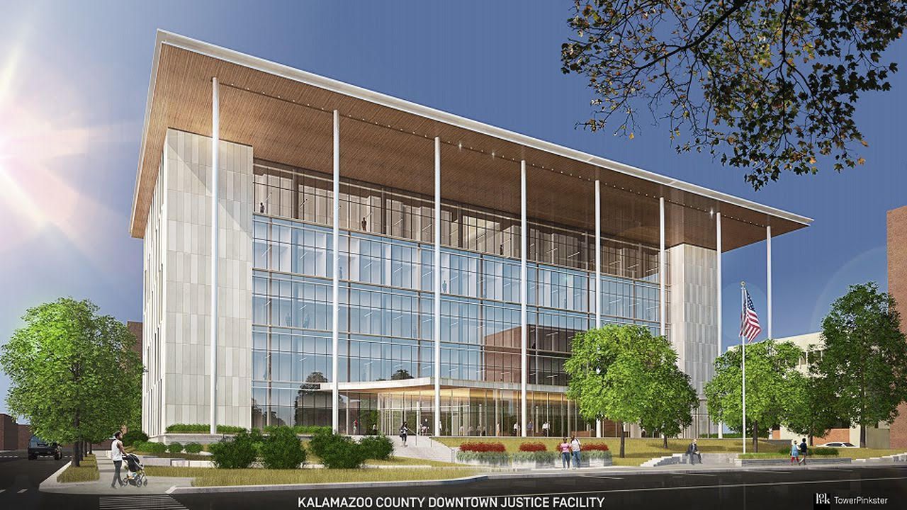 An artist 's impression of a large building with a wooden roof surrounded by trees.