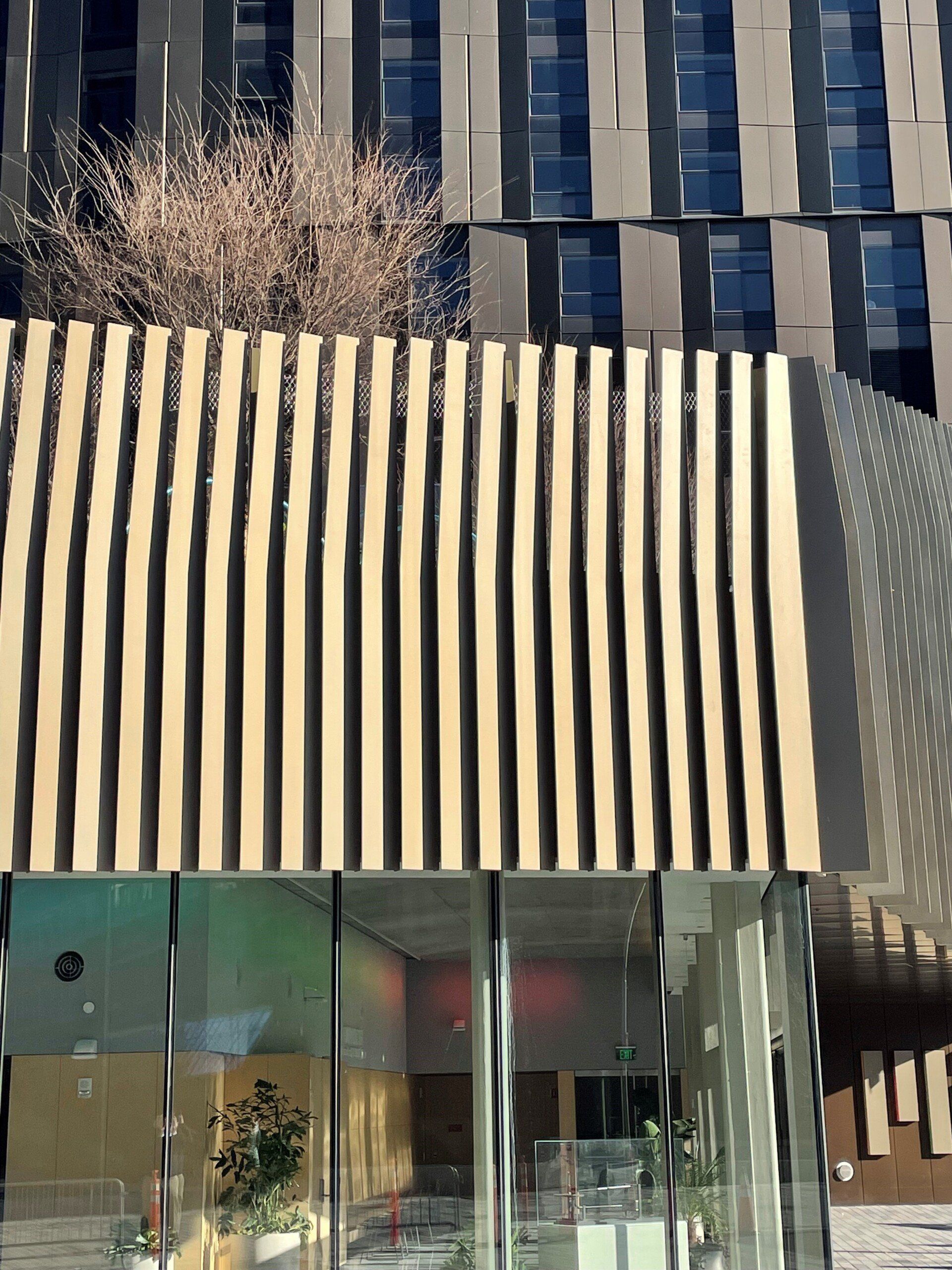 A building with a wooden fence on the side of it.