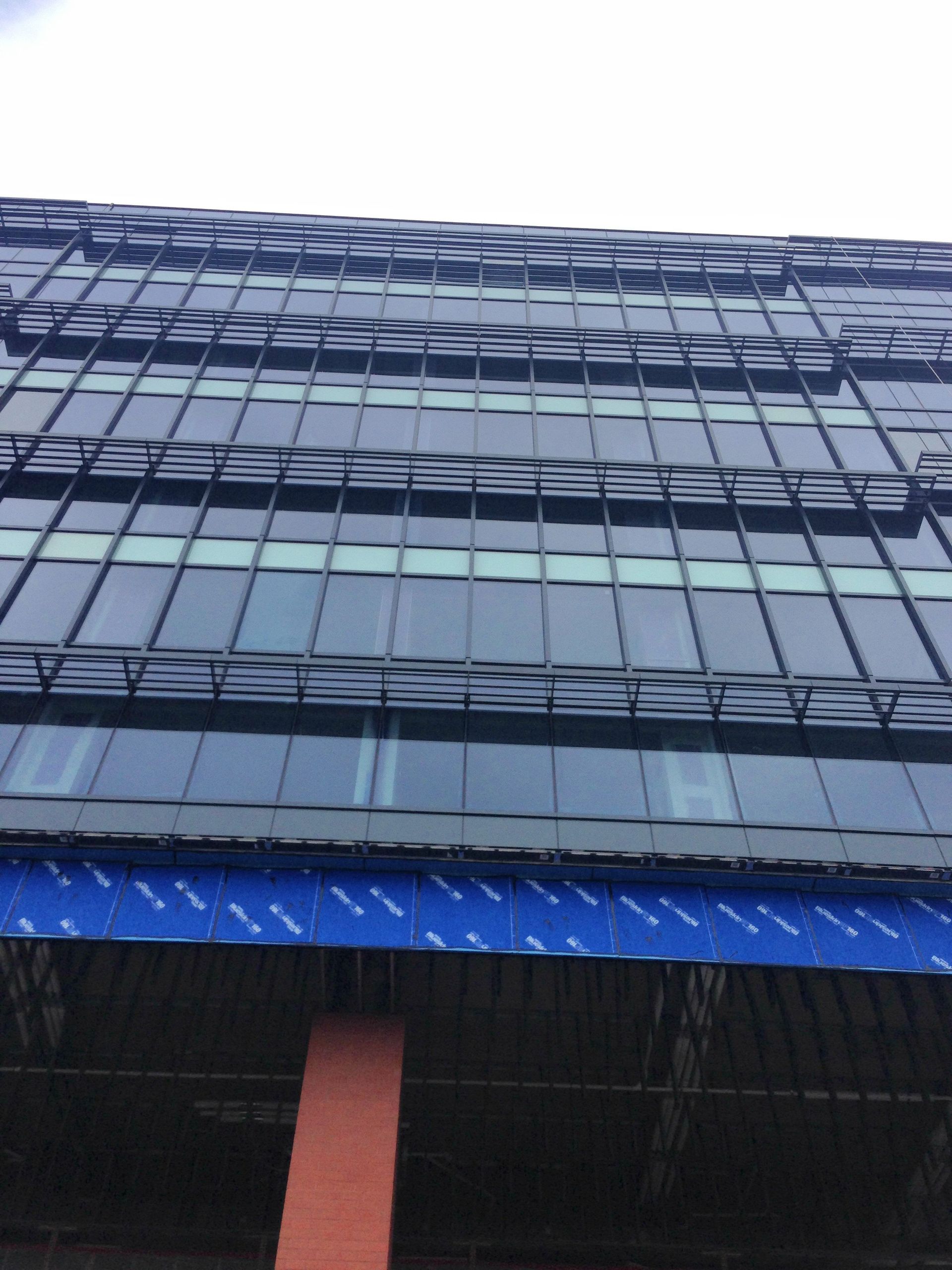 A building with a lot of windows and a blue roof