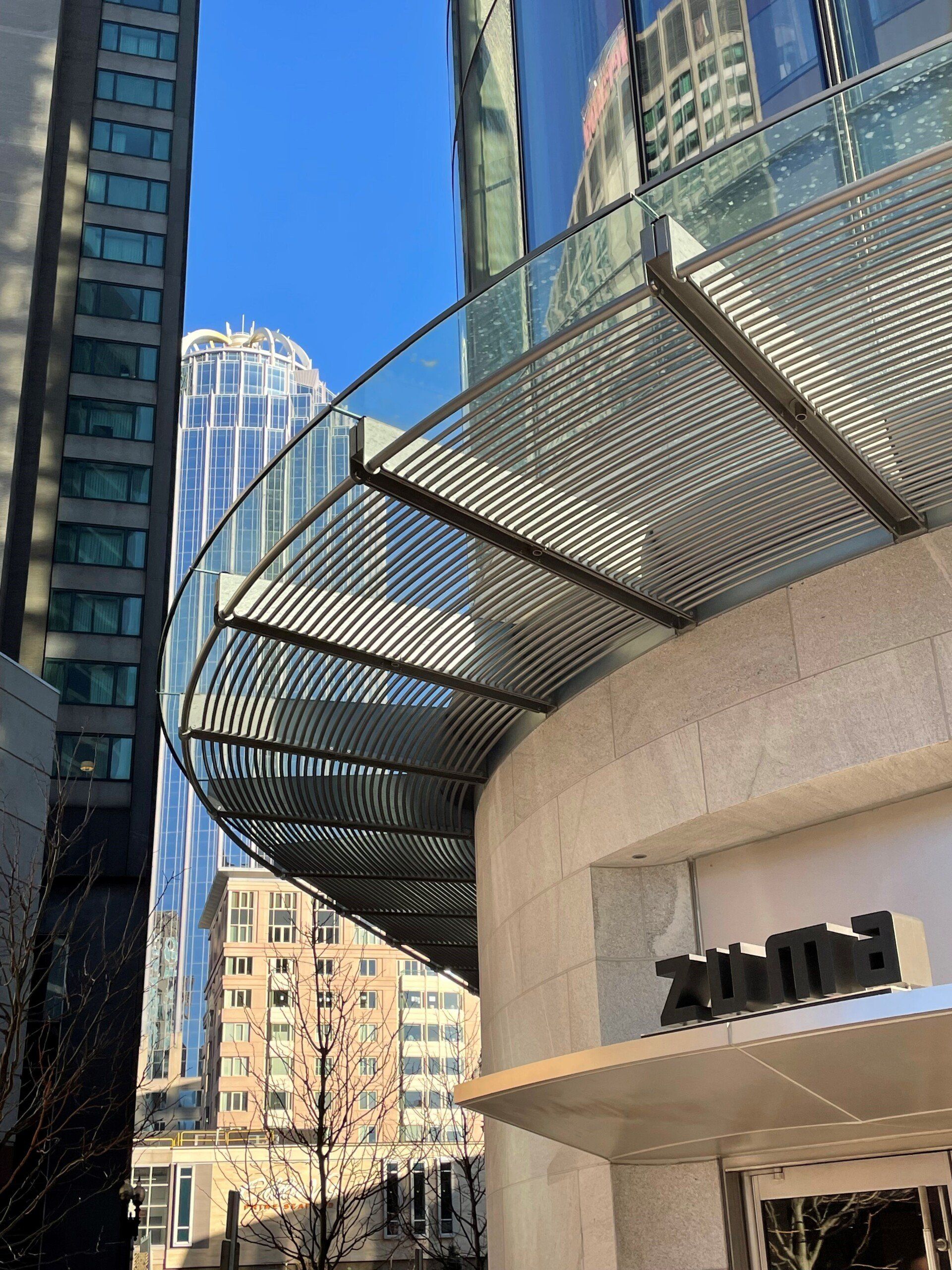 A building with a sign that says ' zuma ' on it